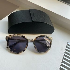 Prada sunglasses. Gray lenses. Case included.